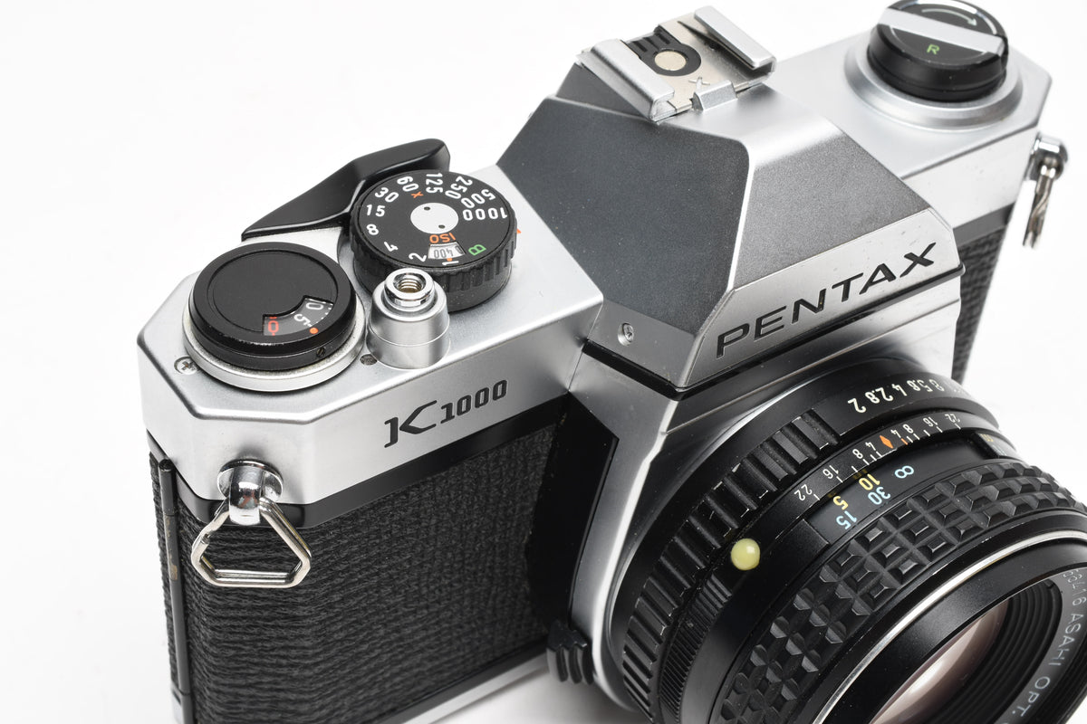 Pentax K1000 35mm SLR w/55mm f2 SMC lens, New seals, strap, Mint-