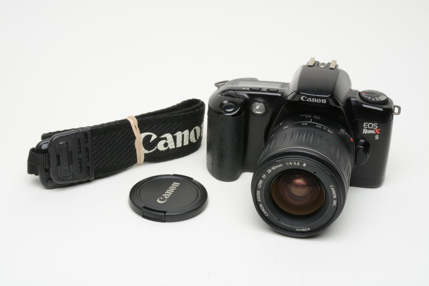 Canon EOS Rebel XS 35mm SLR, w/EF 28-90mm F4-5.6 III zoom, strap, cap, UV