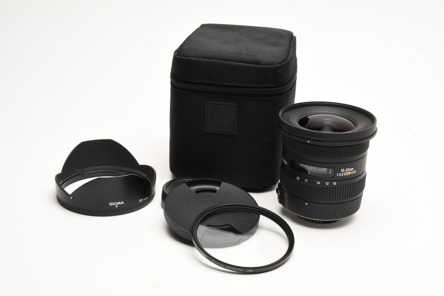 Sigma AF 10-20mm f3.5 DC HSM wide zoom lens Nikon Hood, caps, UV, case Mint-