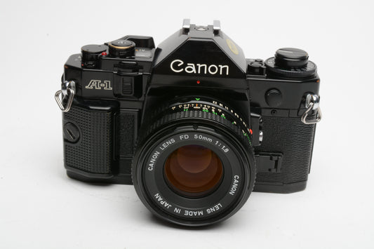 Canon A-1 35mm SLR w/50mm F1.8 FD lens, grip, strap, new seals, Nice!