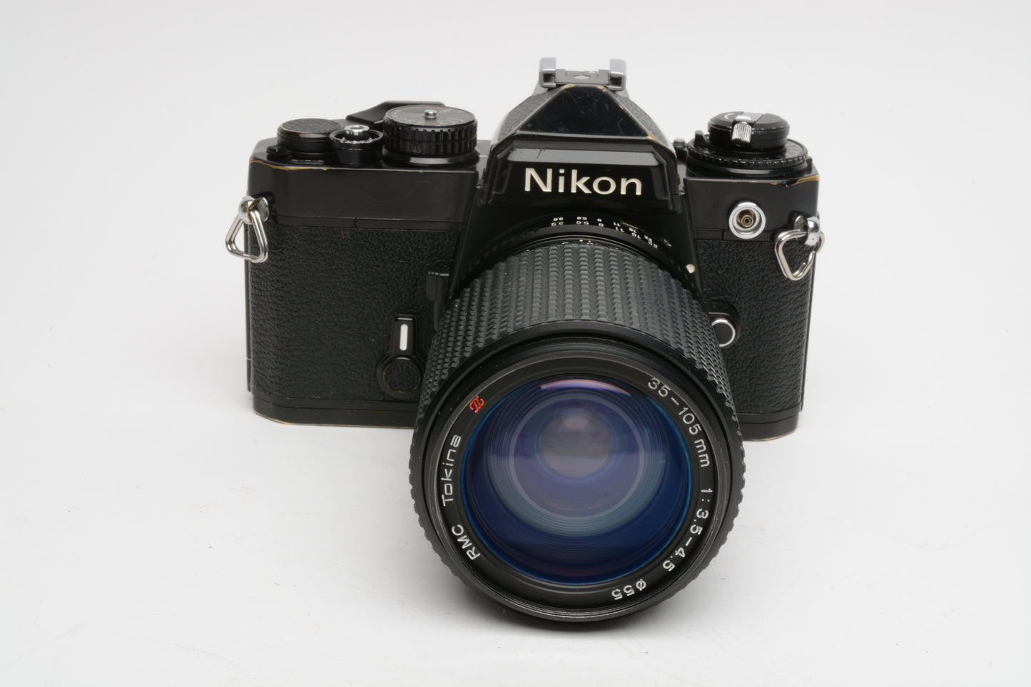 Nikon FE Black 35mm SLR w/Tokina RMC 35-105mm f3.5-4.5, cap+strap, new seals