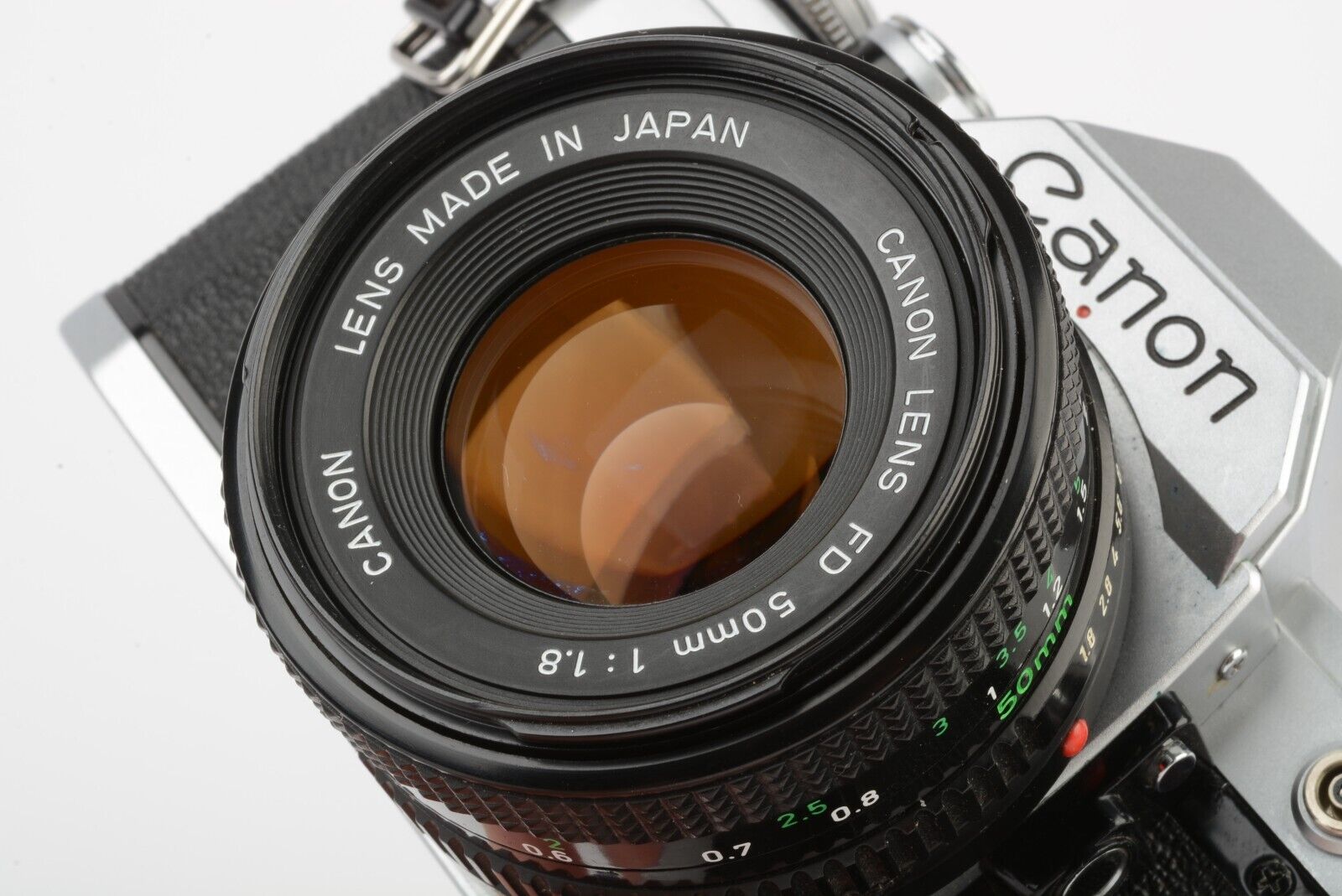 Canon AE-1 35mm SLR w/50mm F1.8 lens, new seals, book, strap, CLA
