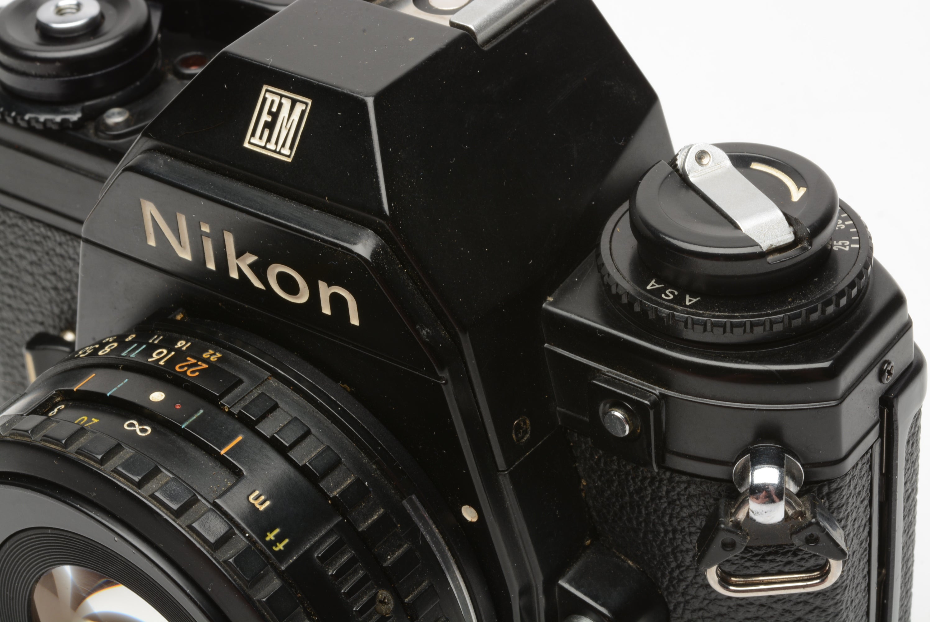 Nikon EM 35mm SLR w/Nikon Series E 50mm f1.8 lens, strap, cap
