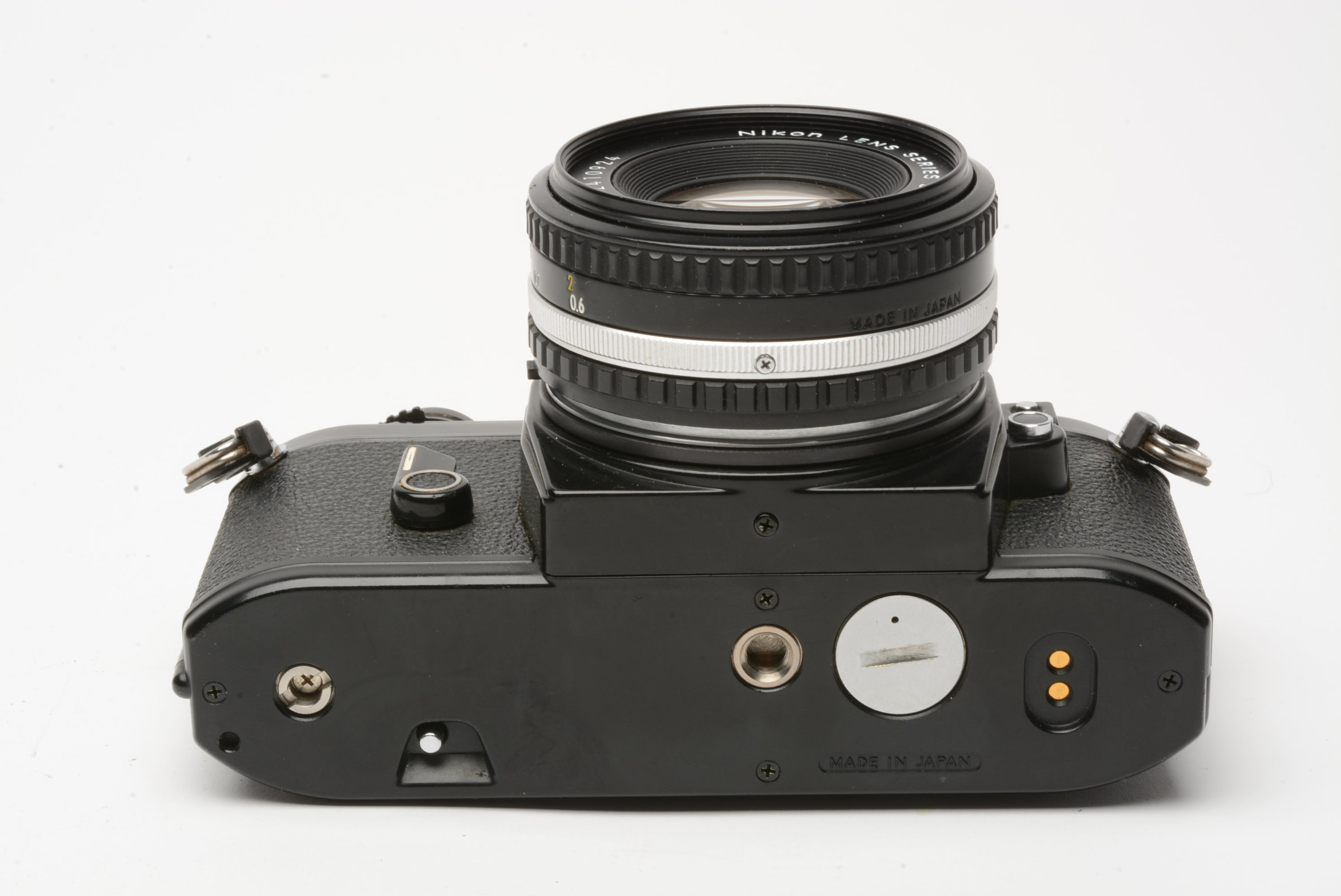 Nikon EM 35mm SLR w/Nikon Series E 50mm f1.8 lens, strap, cap, manual, new  seals