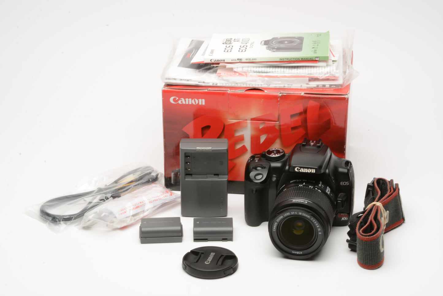 Canon XTi DSLR w/18-55mm f3.5-5.6 II zoom lens, 2batts, charger, strap, manuals